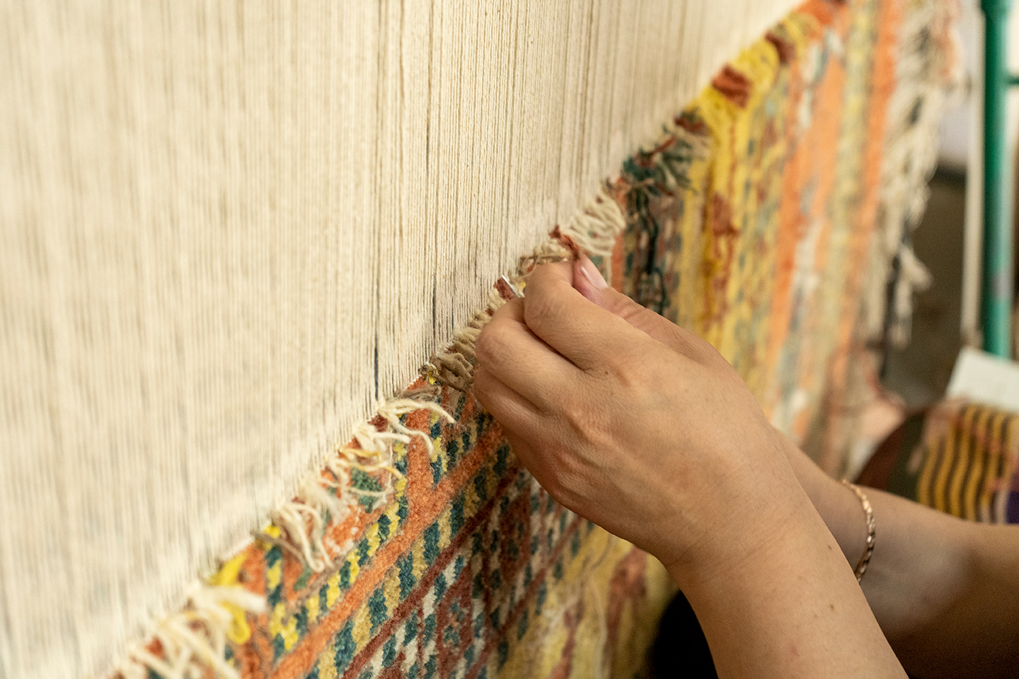 Woman Weaving Traditional Carpet